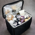 Black cosmetic bag with a padded, reflective interior filled with beauty and cosmetics products.