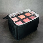 Makeup bag filled with makeup palettes.